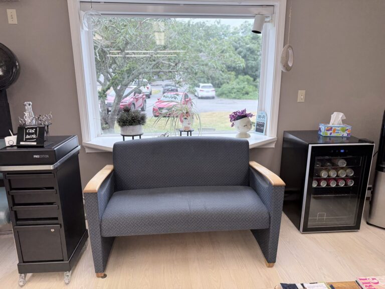 Sunlit lounge seating nook at New Image Hair Salon, Cape Cod