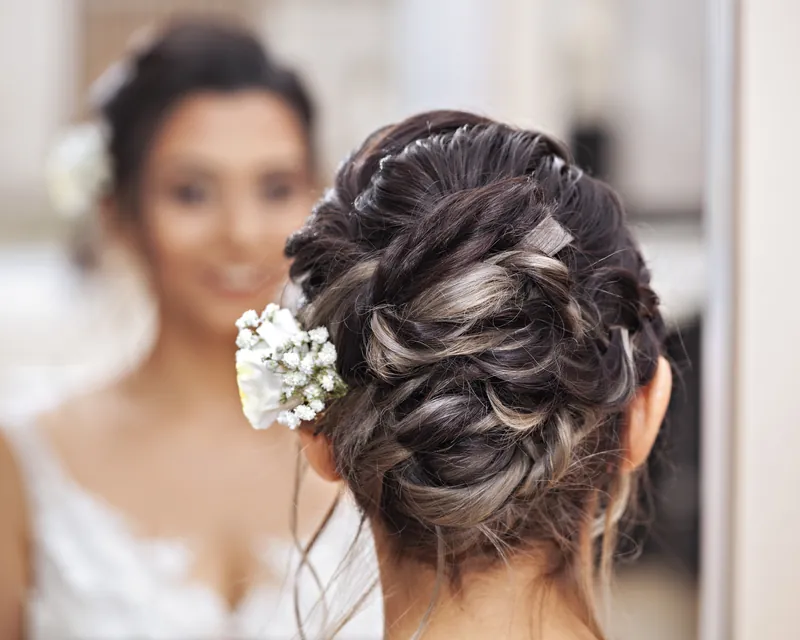 Bridal updo with pearl hairpiece, wedding hair at New Image Hair Salon in Dennis MA
